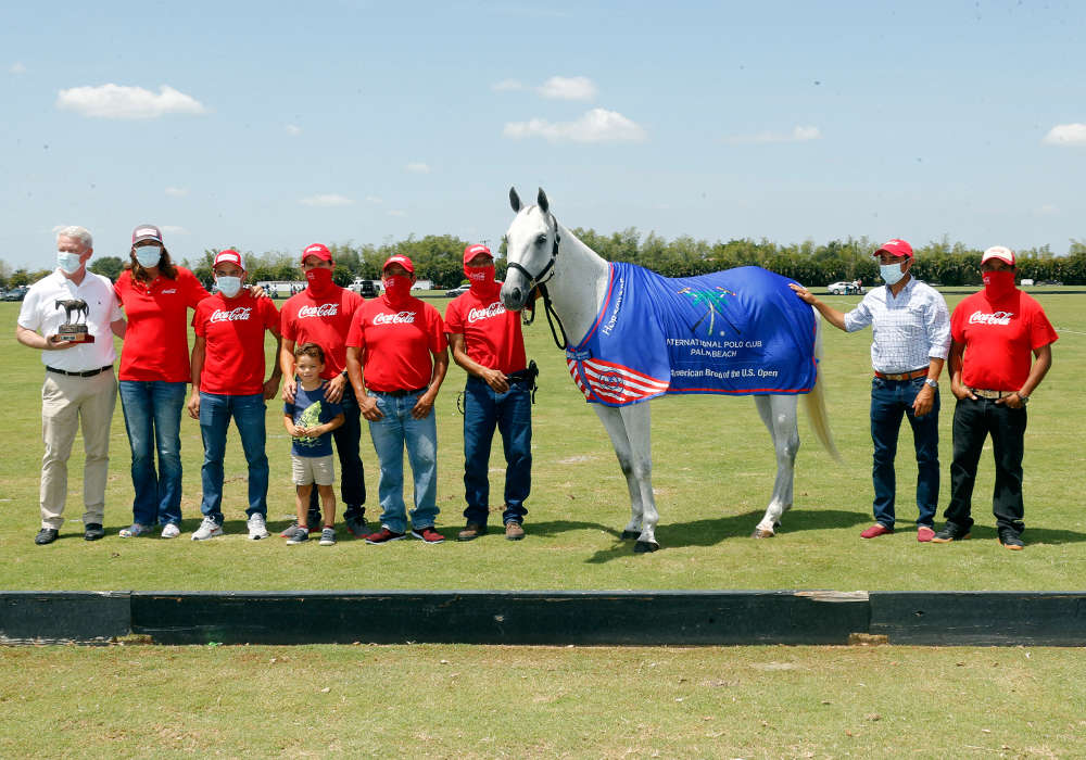 International Polo Club Best American-Bred Horse of the U.S. Open Polo Championship®: Hibachi, played and owned by Gillian Johnston. Presented by Board of Governor Mike Carney and pictured with Miguel Lagos, Daniel Vilches, Milo Vilches, Jesus Romero, Segundo Romero, Alejandro Caro, Manuel Romero.