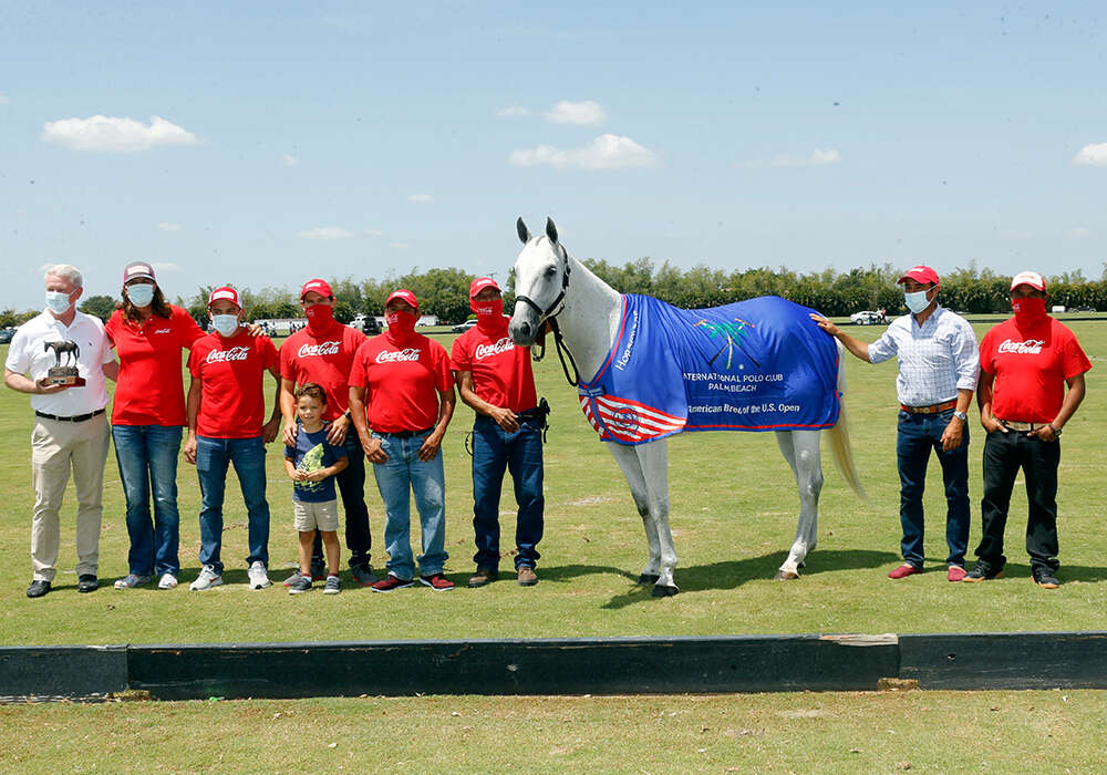 International Polo Club Best American-Bred Horse of the U.S. Open Polo Championship®: Hibachi, played and owned by Gillian Johnston. Presented by Board of Governor Mike Carney and pictured with Miguel Lagos, Daniel Vilches, Milo Vilches, Jesus Romero, Segundo Romero, Alejandro Caro, Manuel Romero.