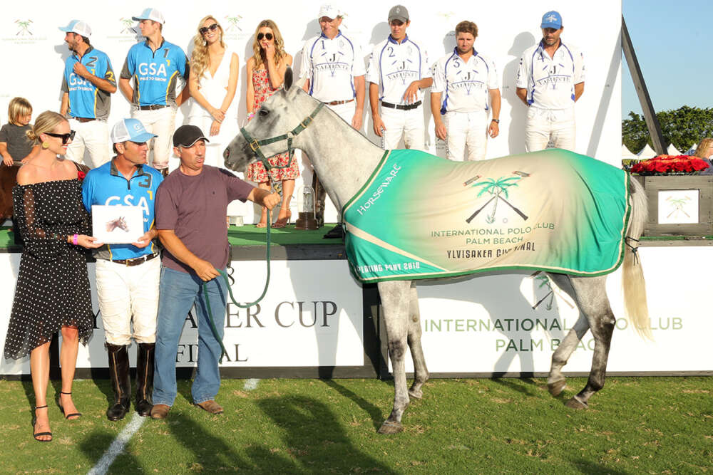 Best Playing Pony Ylvisaker Cup Final: Macarena owned and played by Mariano Gonzalez, presented by Amy Jackson on behalf of NetJets and Four Seasons Resort, pictured with Gerardo "Lalo" Ugarte.