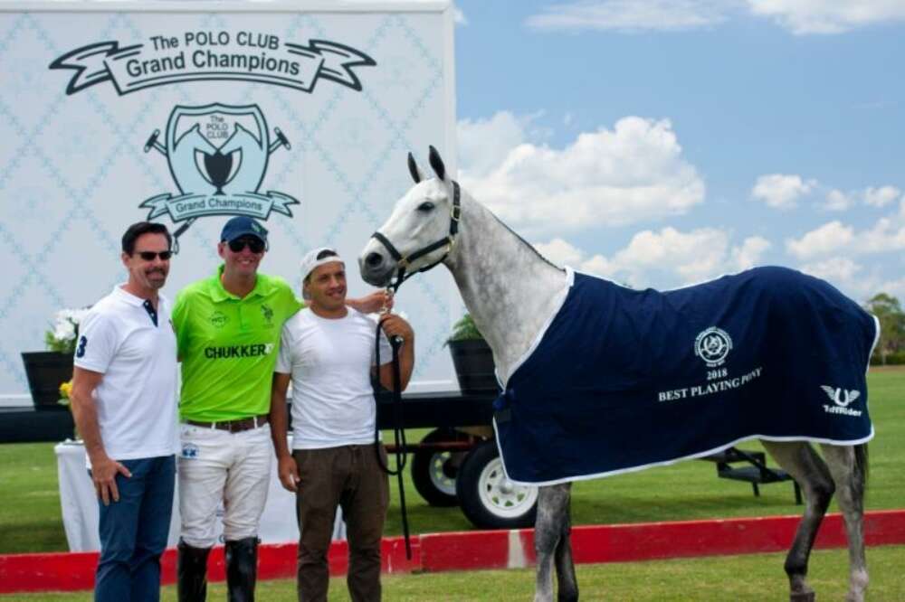 Best Playing Pony Cupid, owned and played by Julio Gracida. Pictured with awards presenter USPA CEO Bob Puetz.