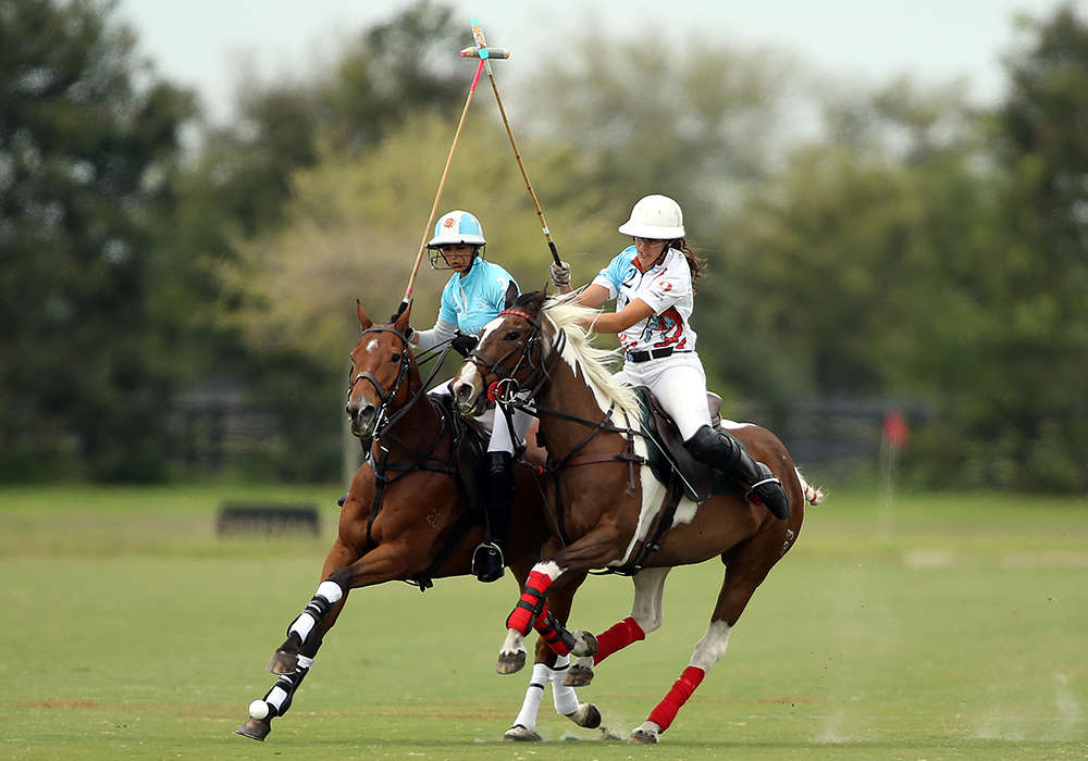 Polo Gear Coffee Company's Danielle Lussi riding off Hawaii Polo Life's Mia Cambiaso while on Pretty Bird Woman. ©David Lominska