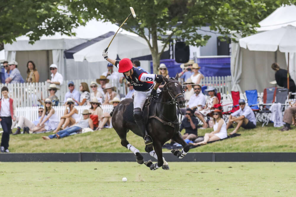 Team USA's Felipe Viana with a textbook swing as he gallops at top speed during the consolation match versus England. 