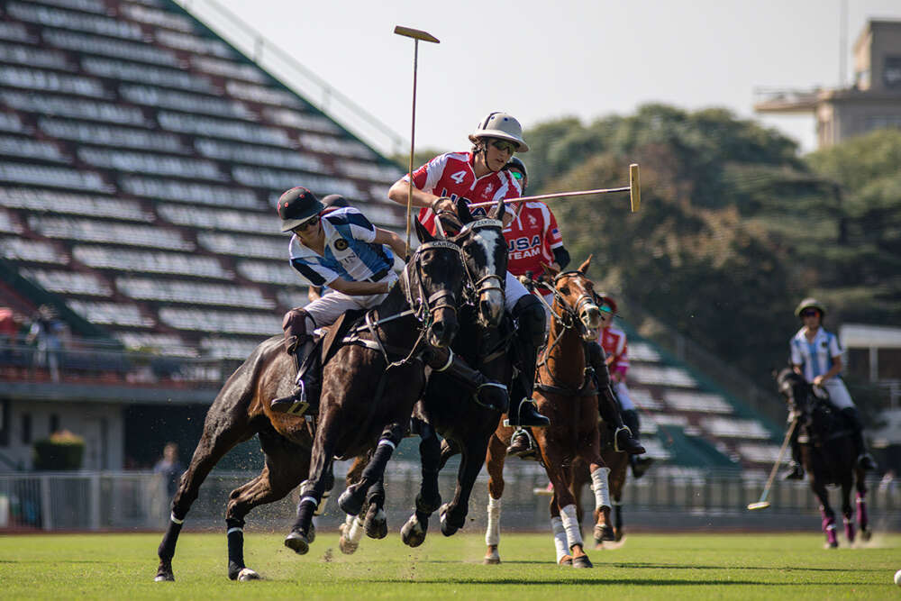 Argentina A's _____ goes for a hard bump on USA's Lucas Escobar. 