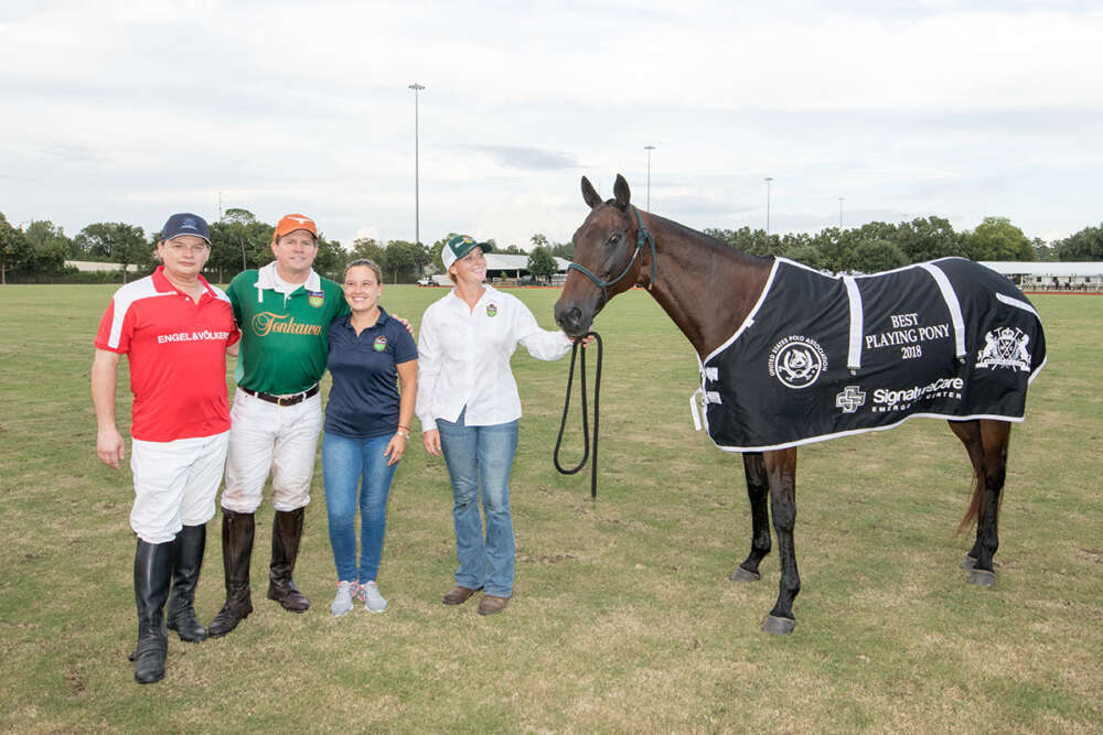 Jeff Hildebrand's Mechita was awarded Sponsor Best Playing Pony. (L to R) Brooks Ballard, Jeff Hildebrand and Marci Banegas, Rebekah Evans.