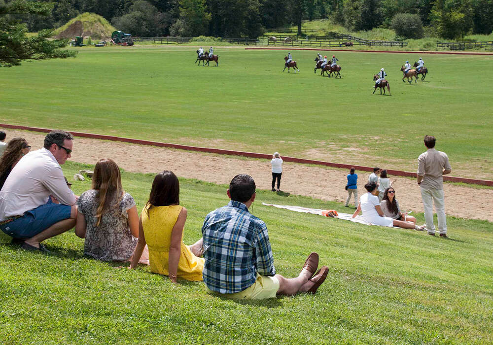 Spectators enjoying polo and sunshine at NYC Polo Club. ©Sarah Corbin