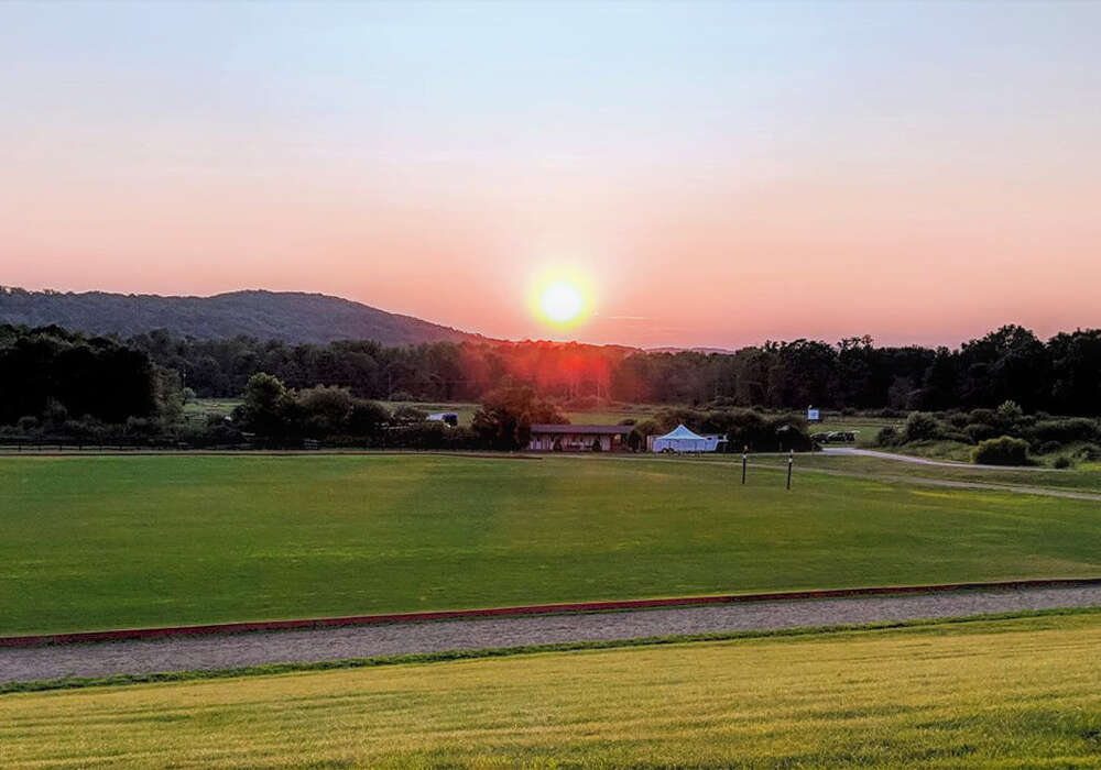 NYC Polo Clubs' pastoral oasis showcases brilliant sunsets. ©Karen Dymersky