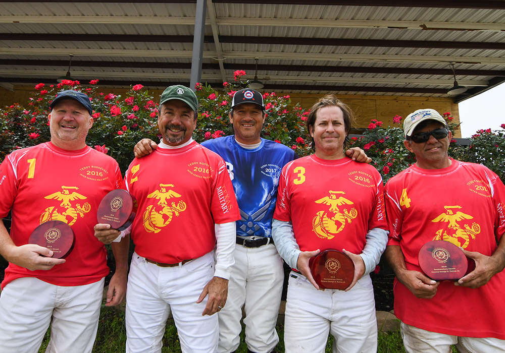 Marine Corps, 2018 USPA Southwestern Circuit General George S. Patton, Jr. champions (L to R) Kyle Brown, Fabian Vela, Cuatro Tolson, and Lalo Ramirez pictured with Pud Nieto.