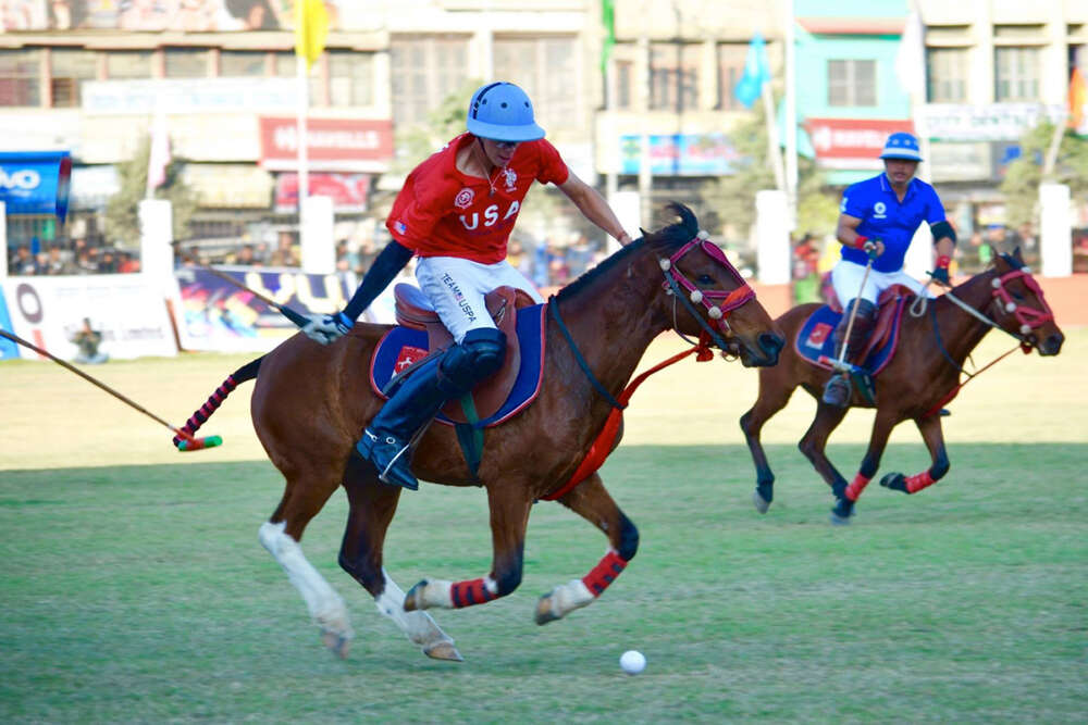 Team USA's Nick Johnson attempts to carry the ball at full speed. 