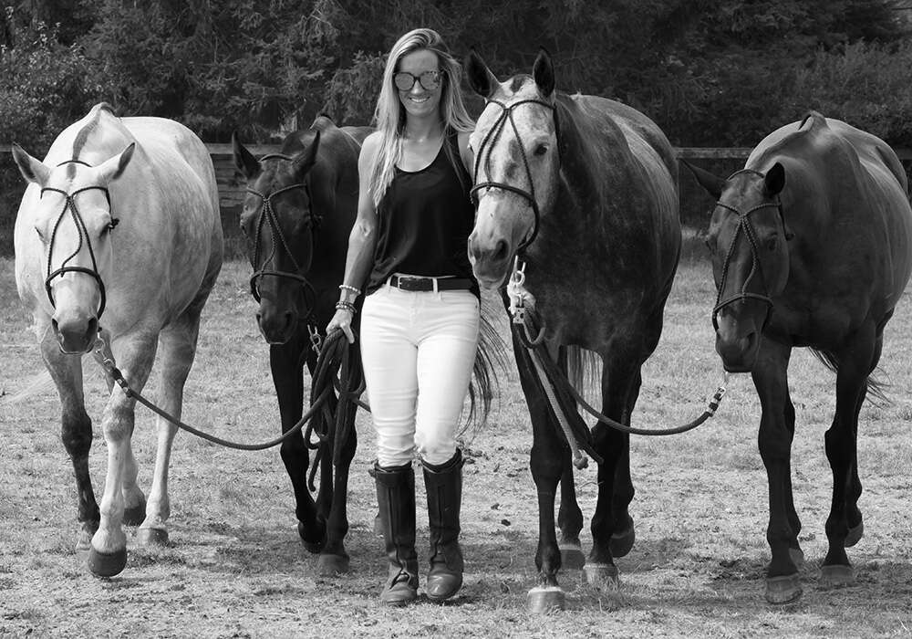 Sheryl leading polo horses