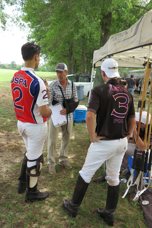 Adam Snow coaches Sloan Stefanakis and Anthony Calle after practice. 