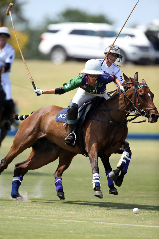 BTA/The Villages' Kylie Sheehan racing forward on Ruby in the U.S. Open Women's Polo Championship®. ©David Lominska.