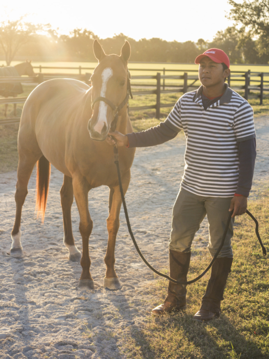 Lola poses with Coca-Cola Groom Sergio Arias at Everglades Polo Club. 