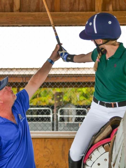 Joey Casey instructs a student in the hitting cage. ©Shelley Heatley.