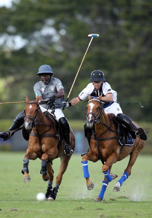 SD Farms' team owner Sayyu Dantata seen in the #1 position, races Dutta Corp/Show+'s Tomas Garcia del Rio for possession.